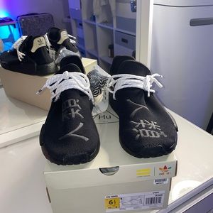 Black adidas HU NMDs